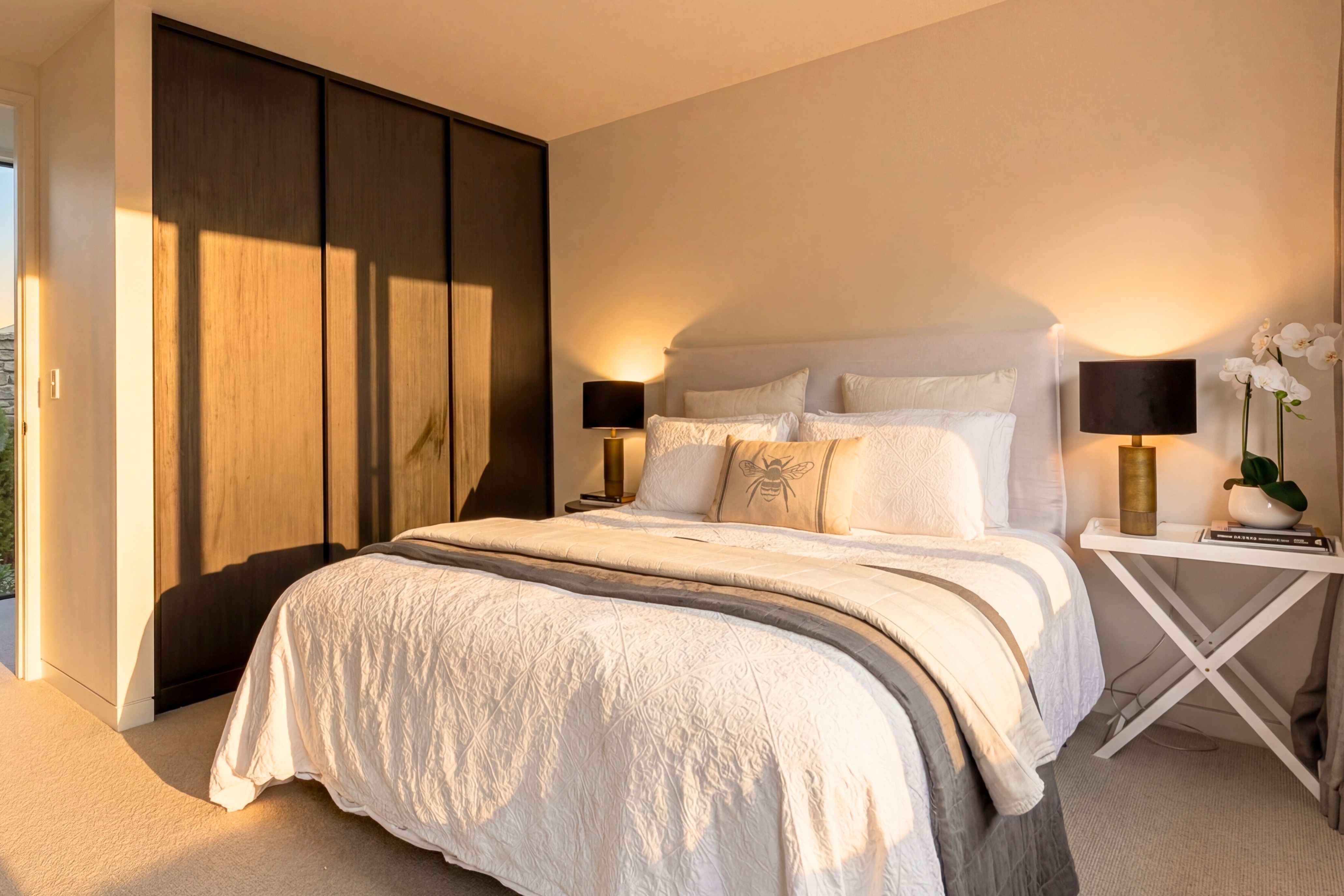 Master bedroom opening to outdoor deck with mountain and lake views
